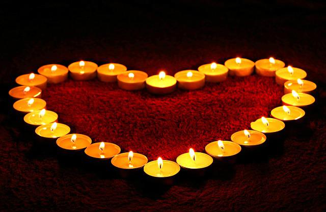 A group of lit candlesDescription automatically generated with low confidence
